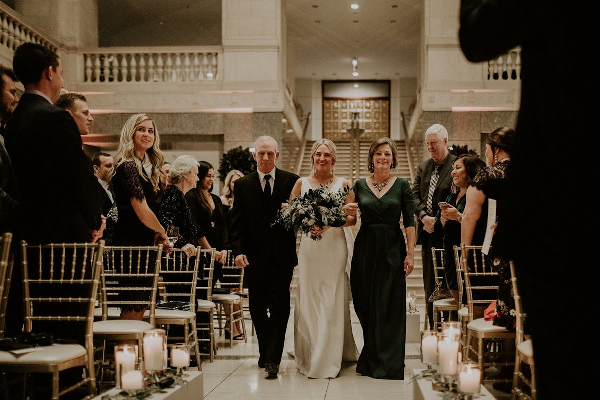 a group of people standing in front of a crowd posing for the camera