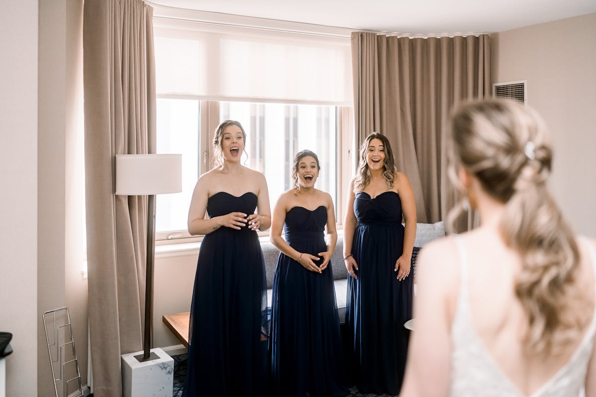 Bride doing first look with braidsmaids