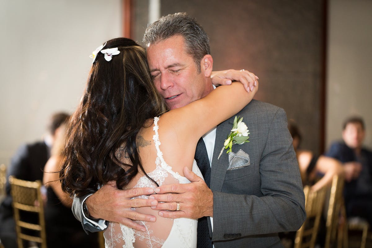 a man and a woman looking at the camera