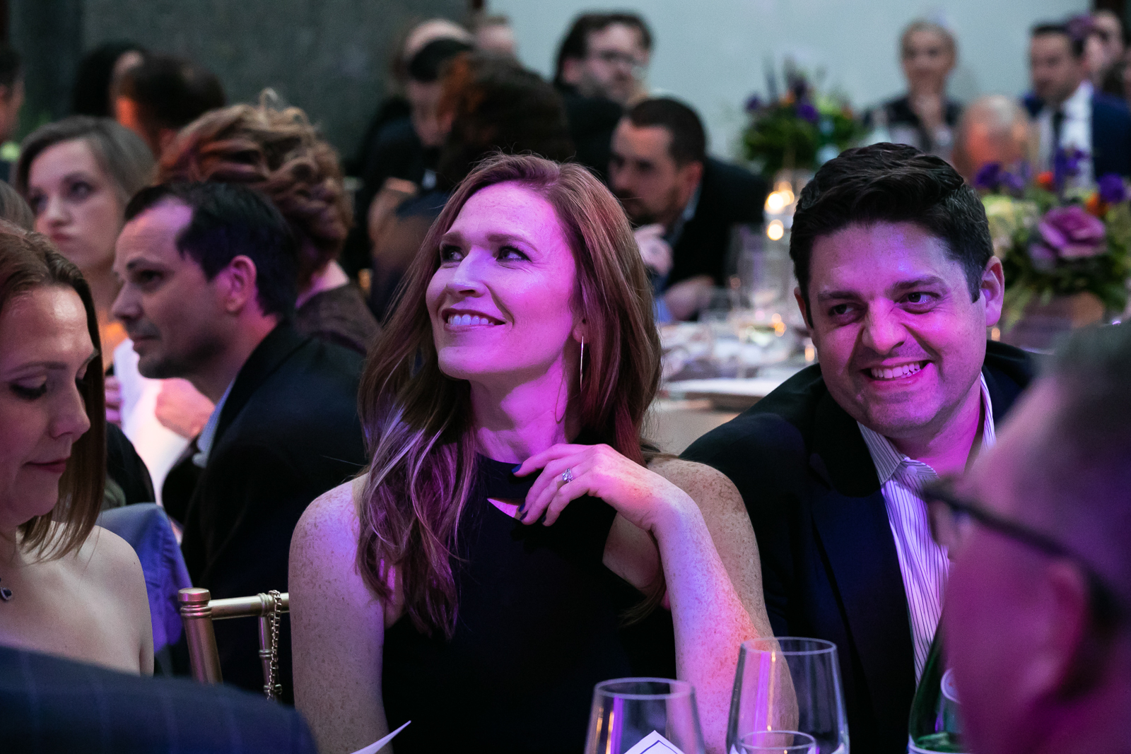 a group of people standing in front of a crowd