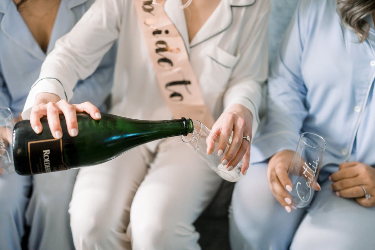 Bride pouring champagne