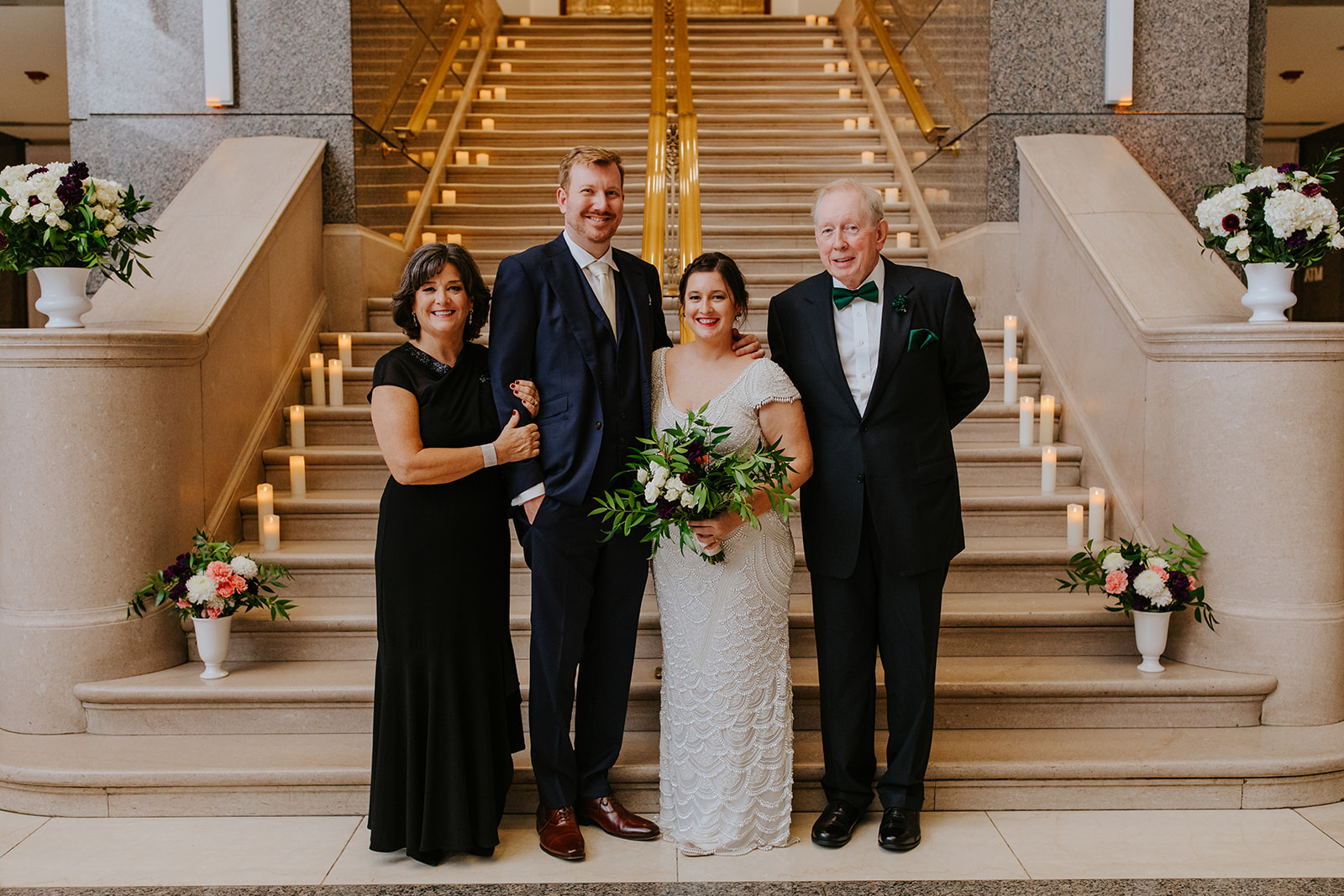 a man and a woman standing in front of a building