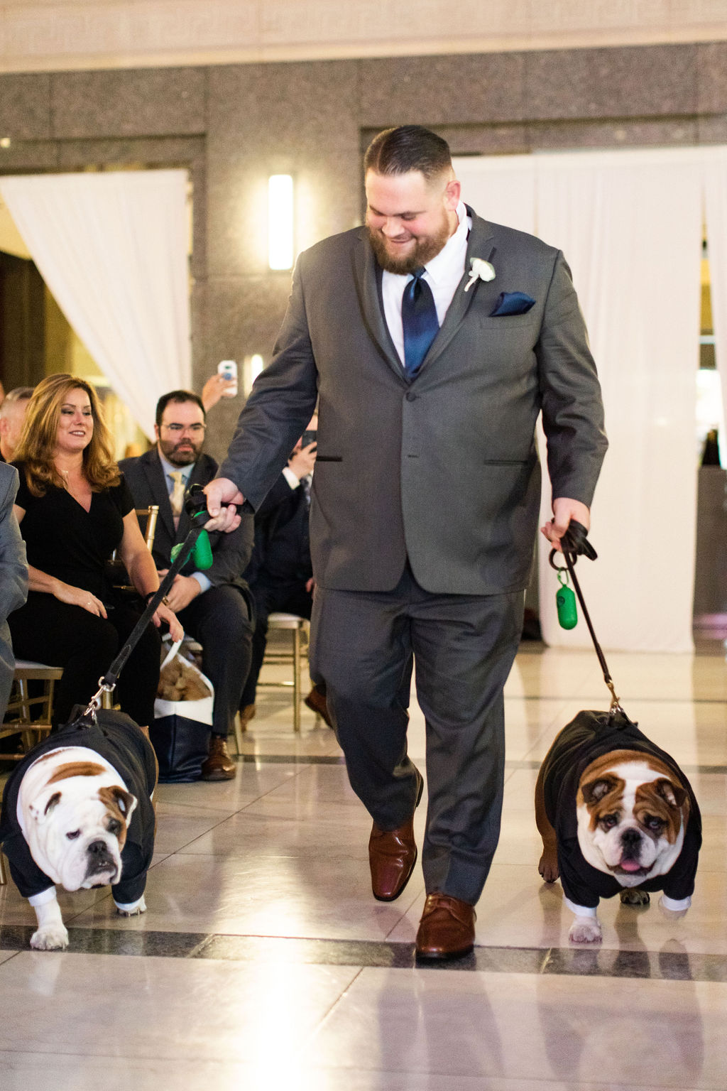 a group of people standing next to a dog