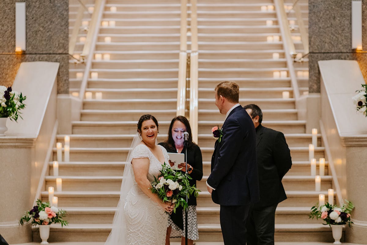 a man and a woman standing in front of a building