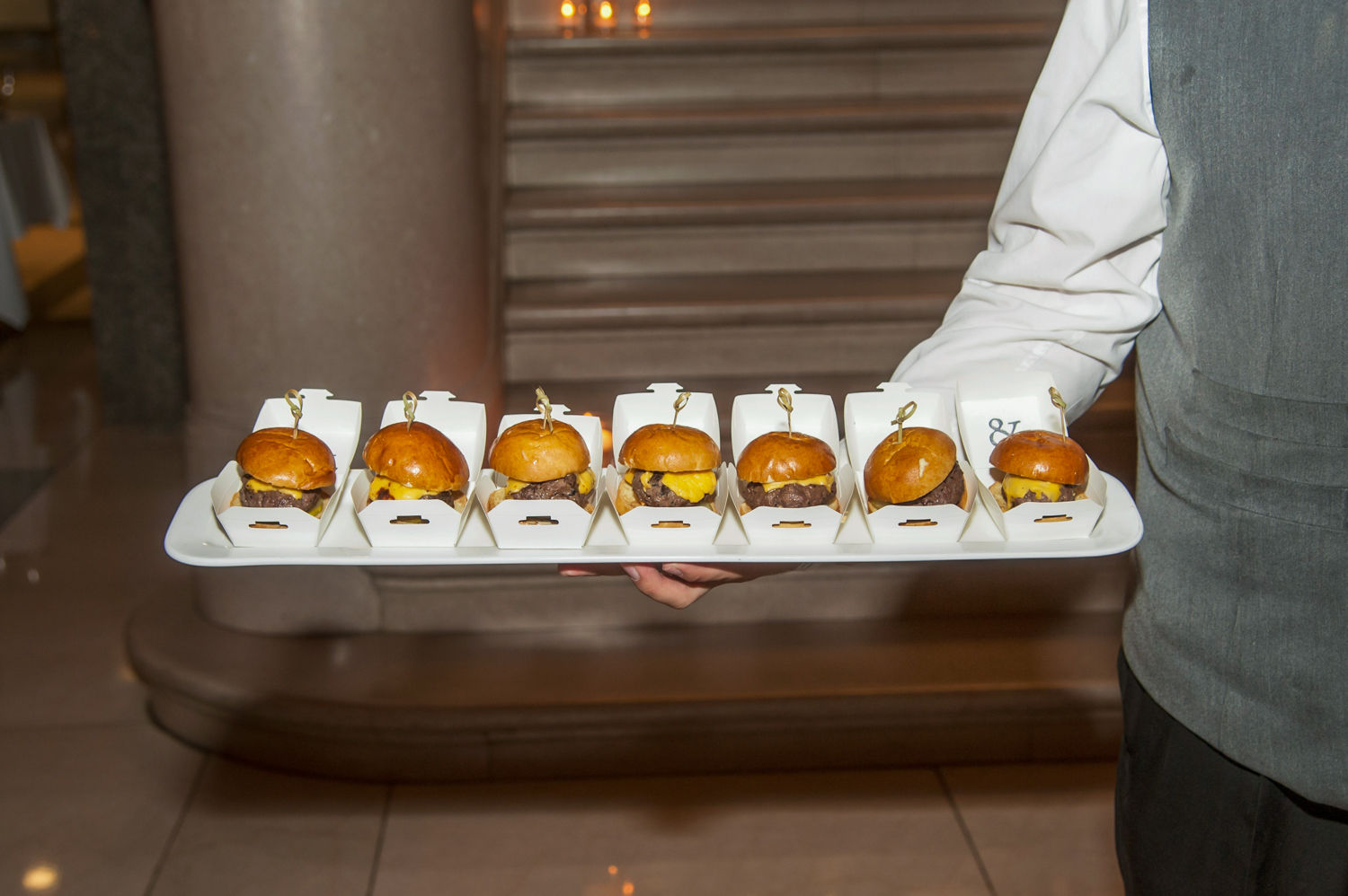 a person standing in front of a doughnut