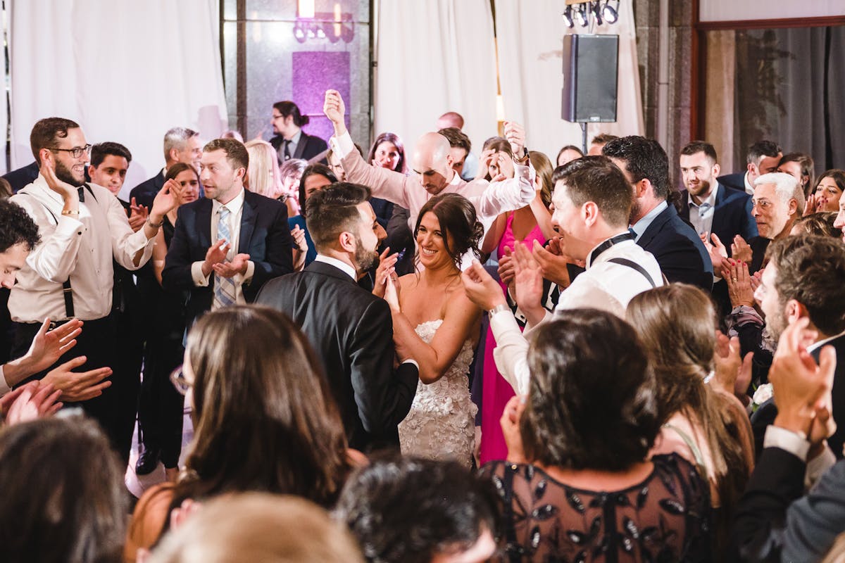 a group of people standing in front of a crowd
