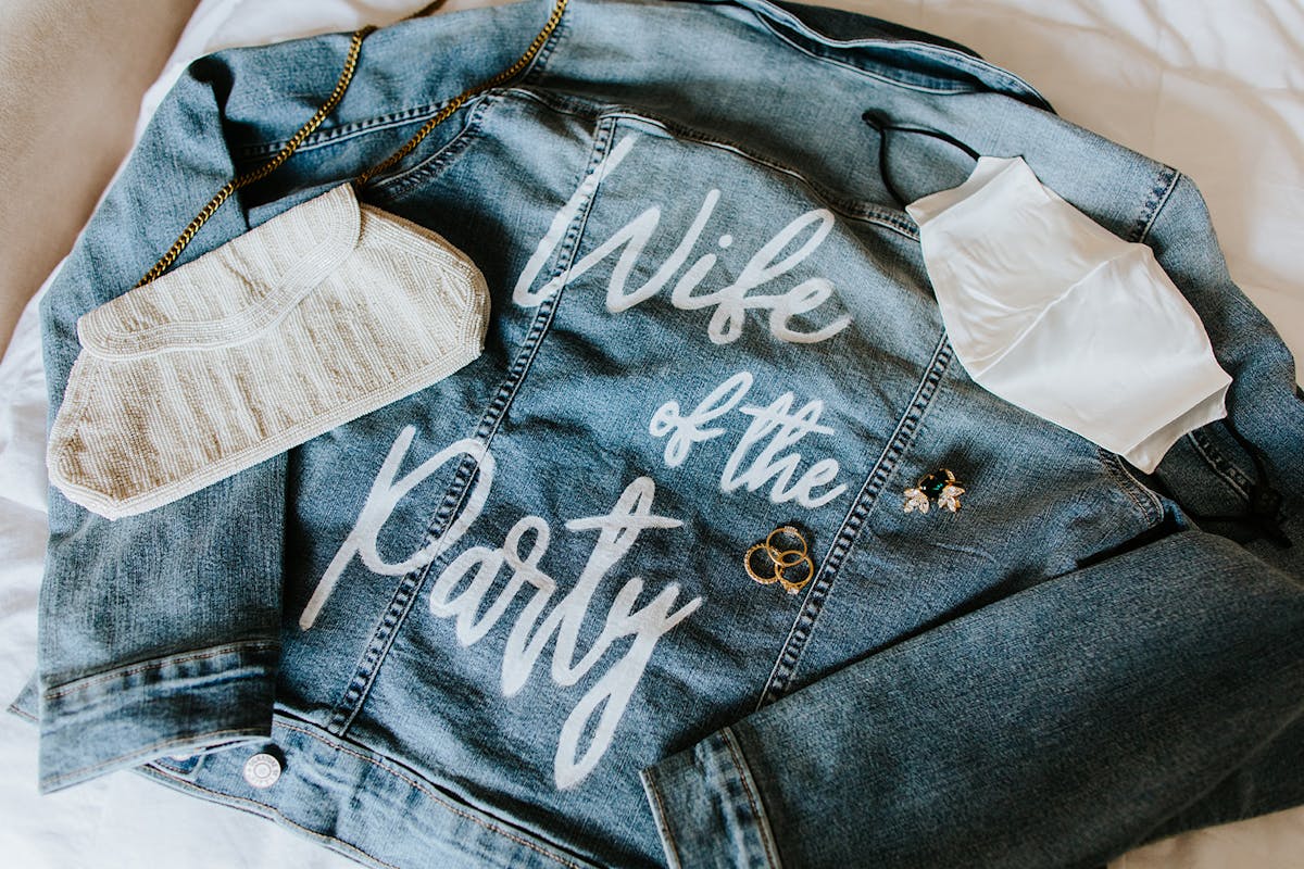 a close up of a hand bag sitting on top of a blanket