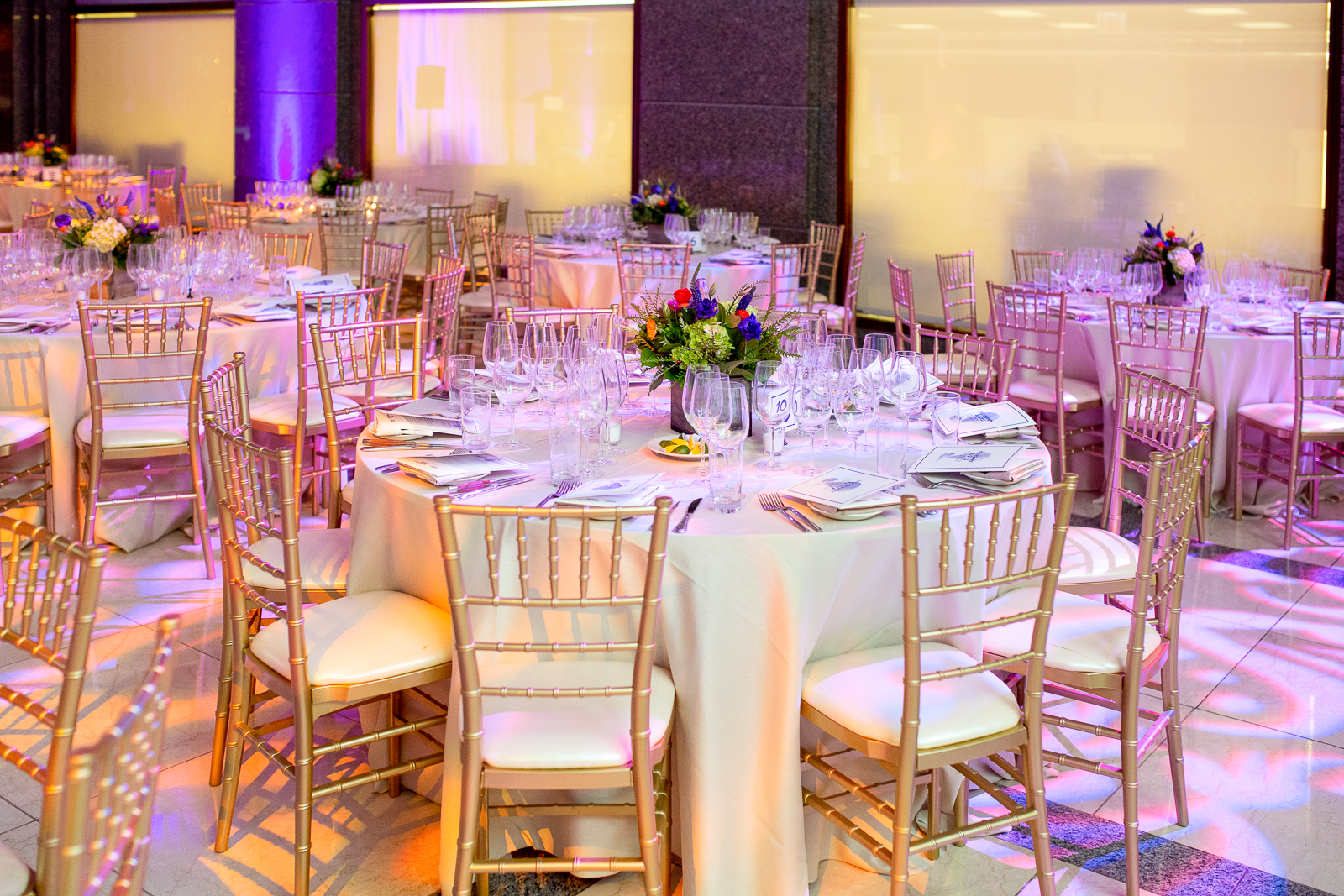 a dining room table filled with wine glasses
