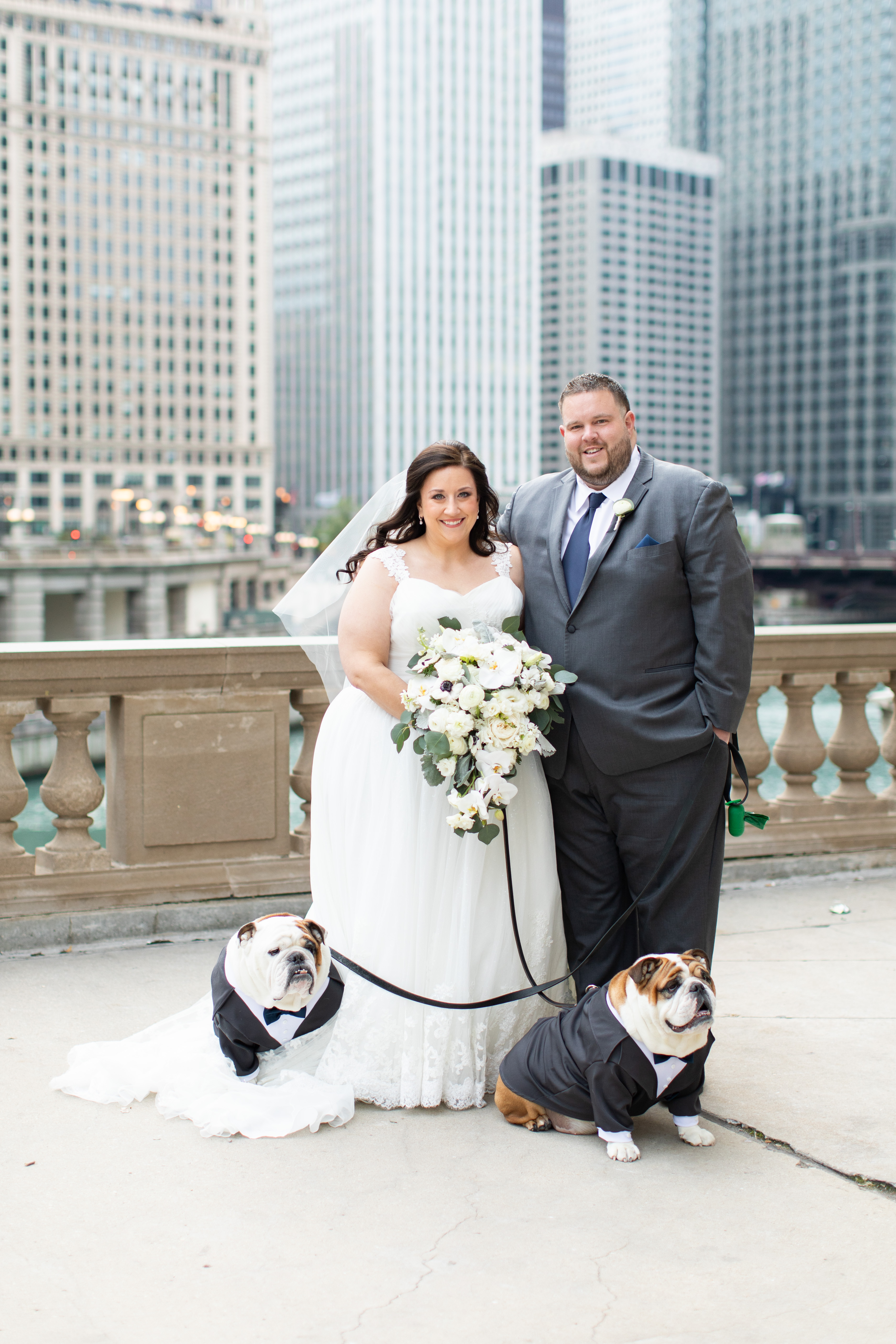 a man and a woman holding a dog