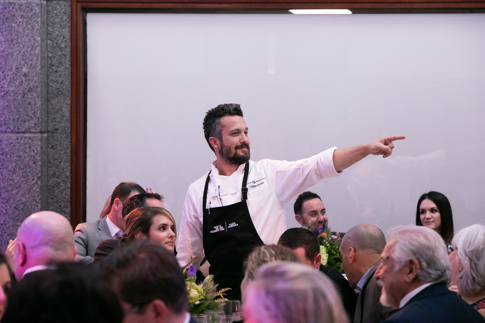Fabio Viviani et al. standing in front of a crowd