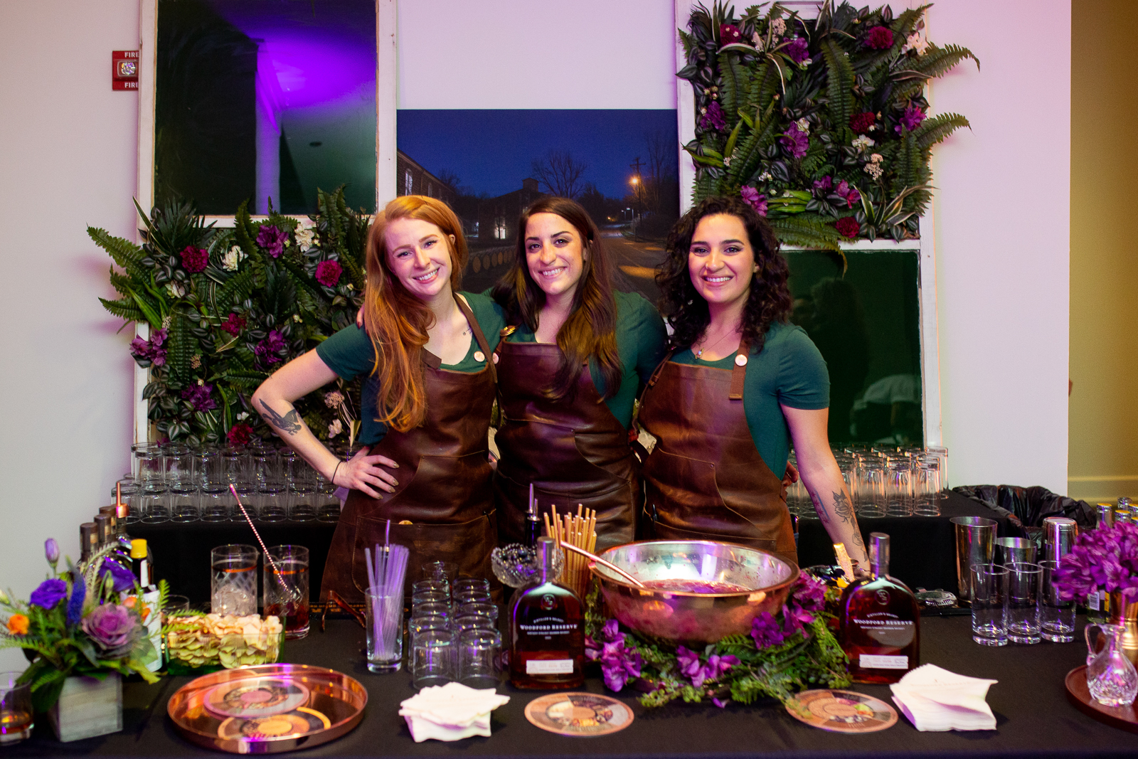 a person standing in front of a cake
