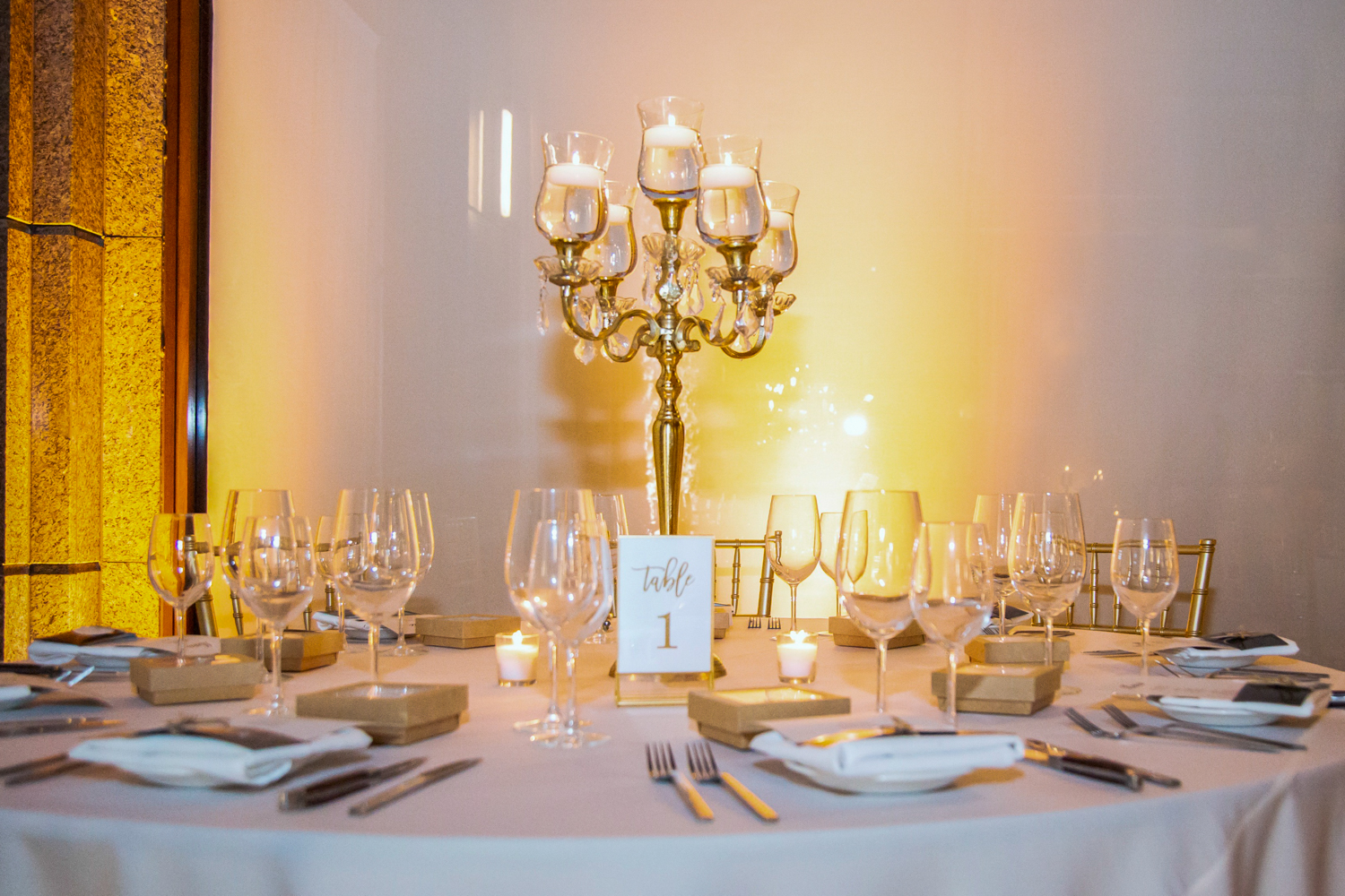 a group of people sitting at a table with wine glasses