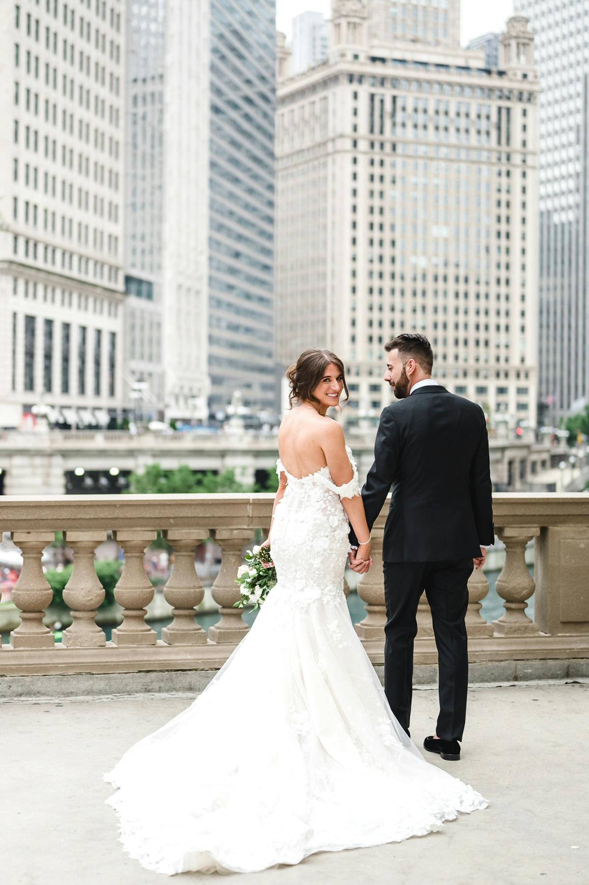 a man and a woman standing in front of a building