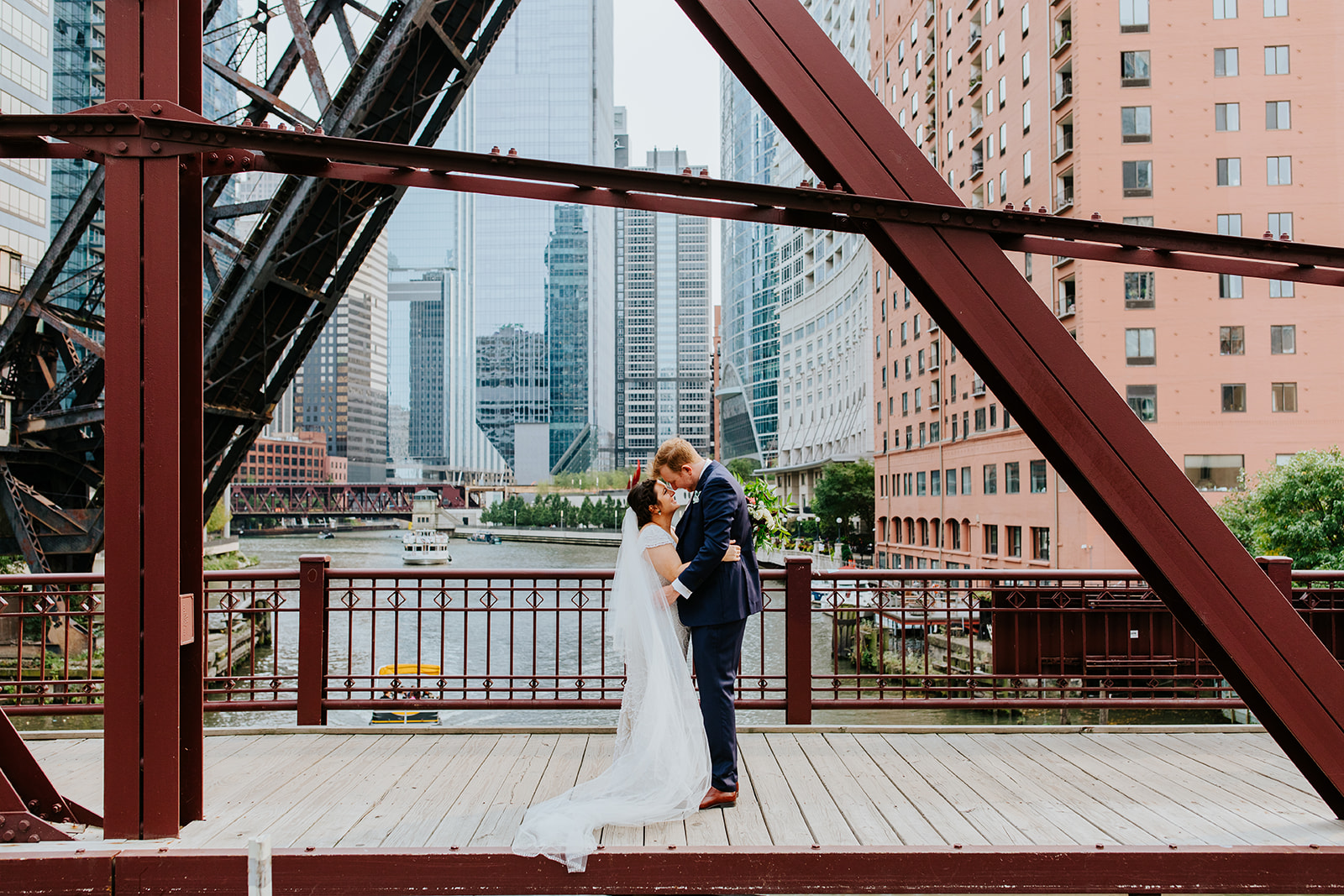 a man standing in front of a bridge