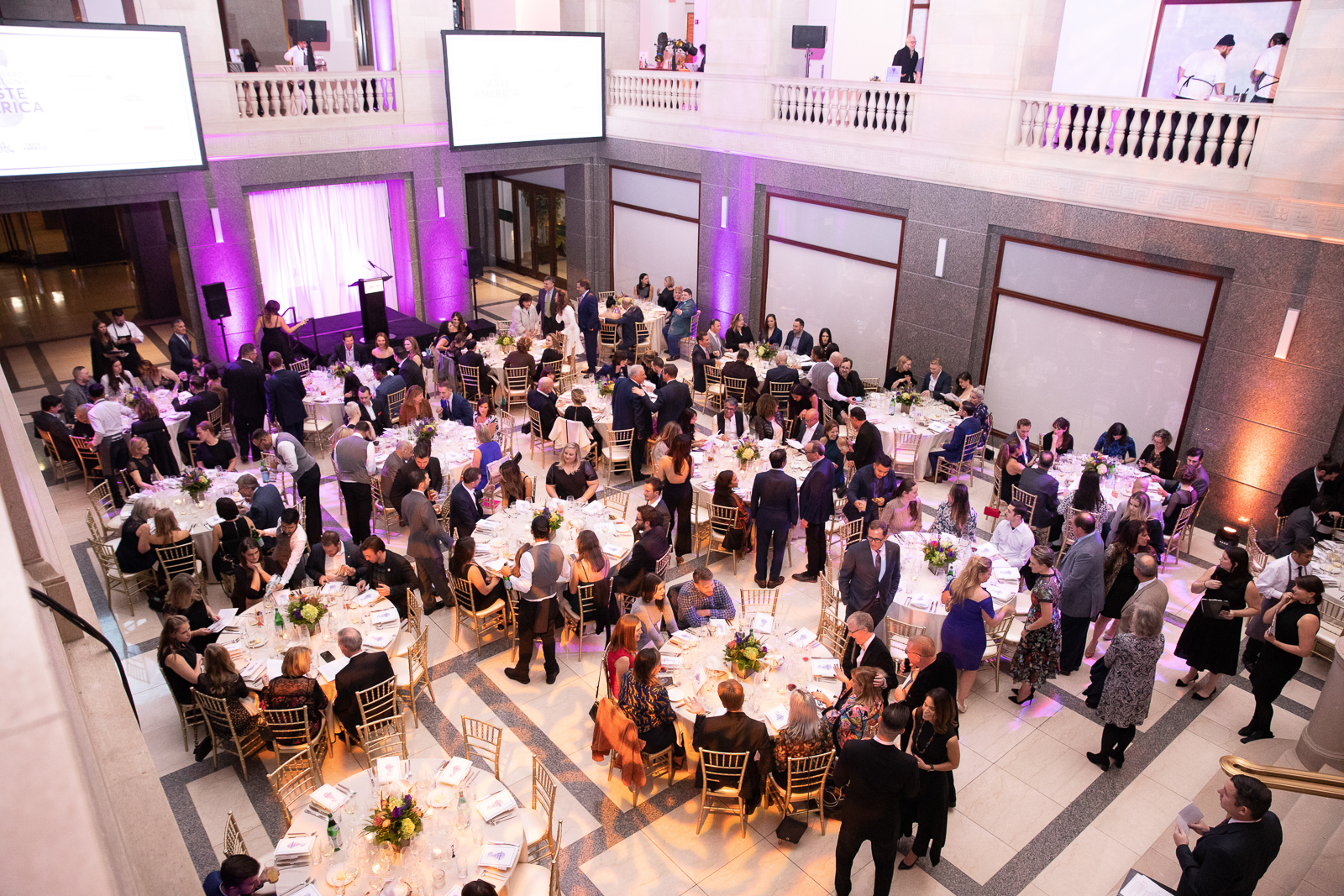 a group of people performing on stage in front of a crowd