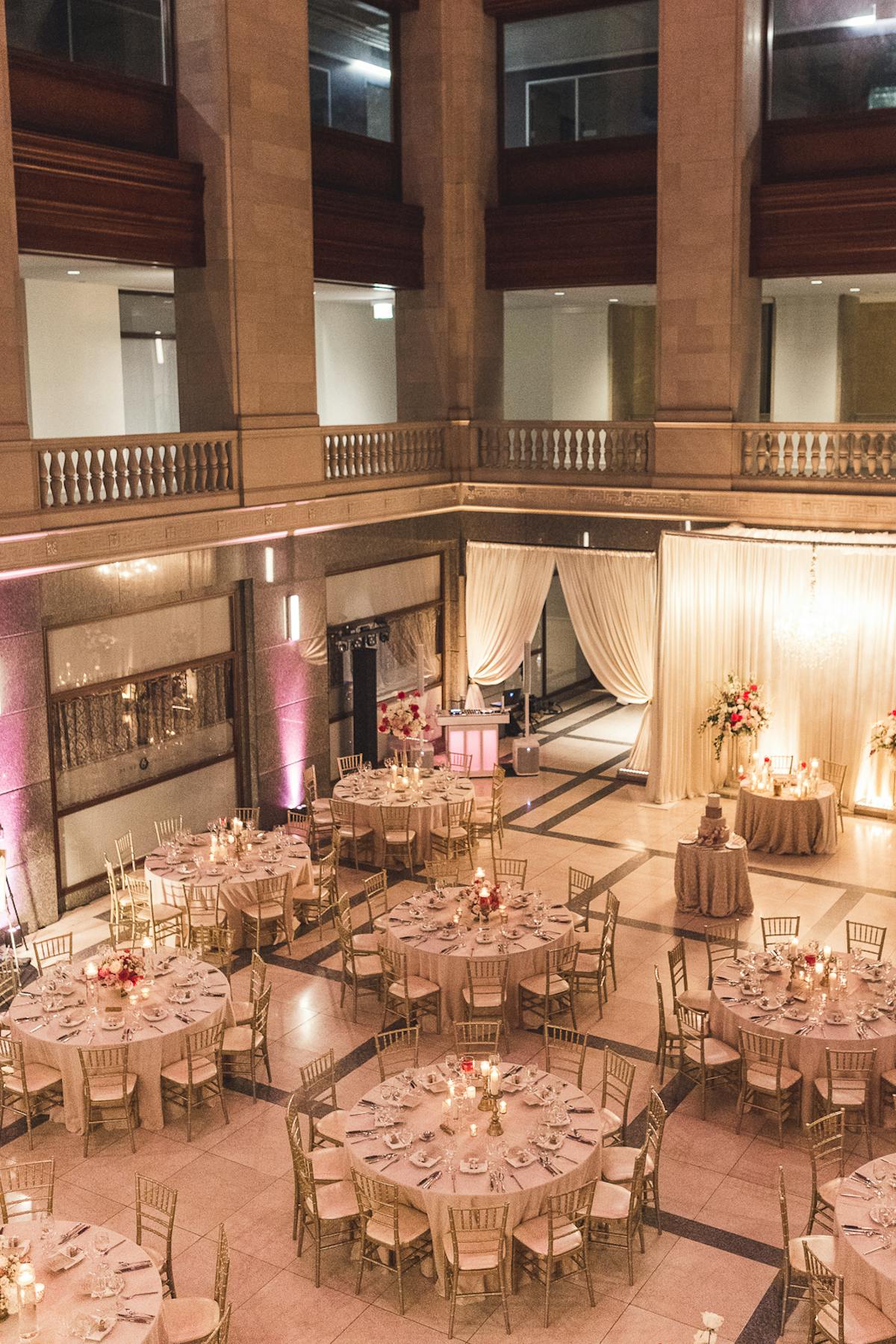 a room filled with furniture and vase of flowers on a table