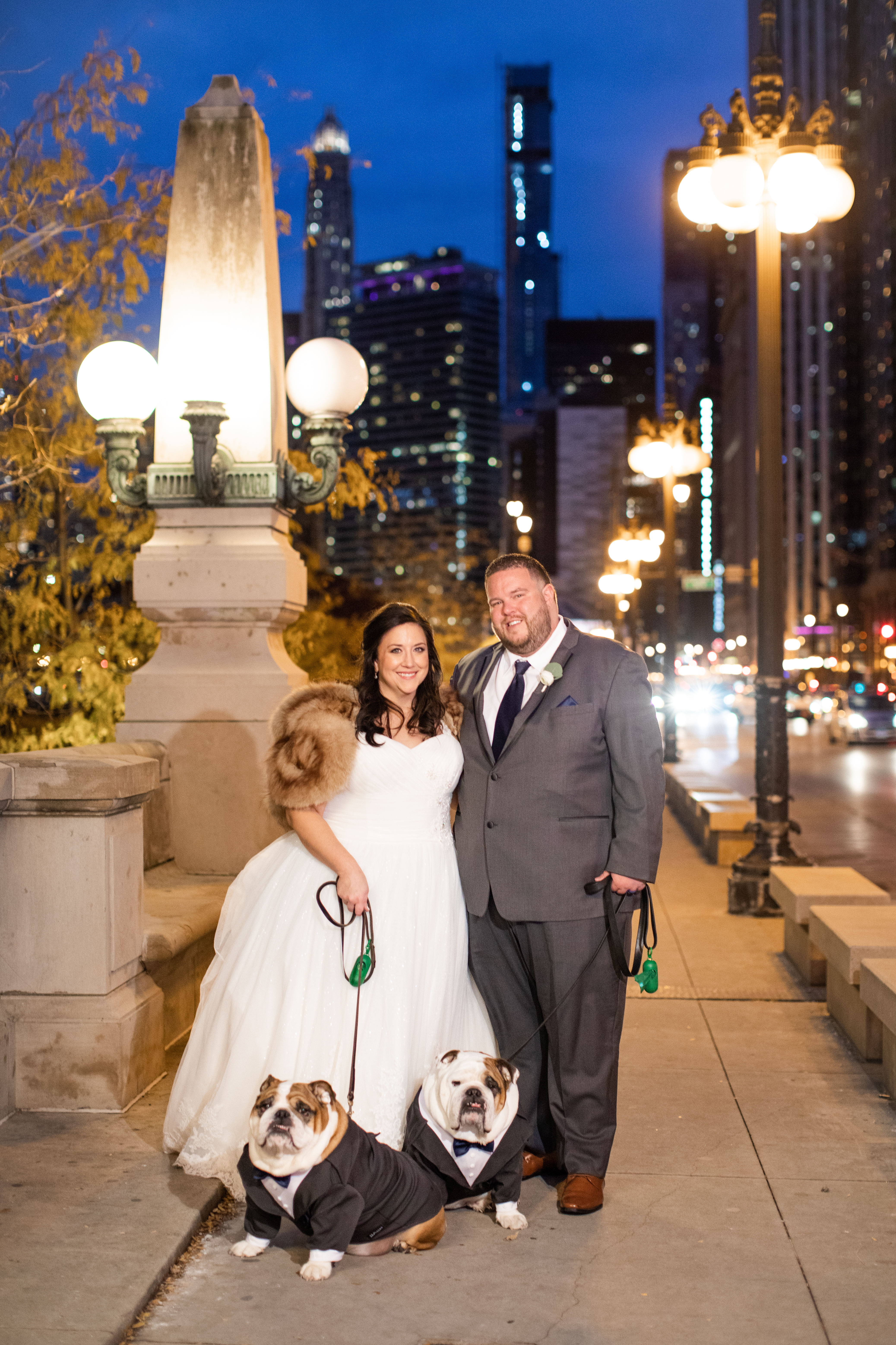 a person holding a dog posing for the camera