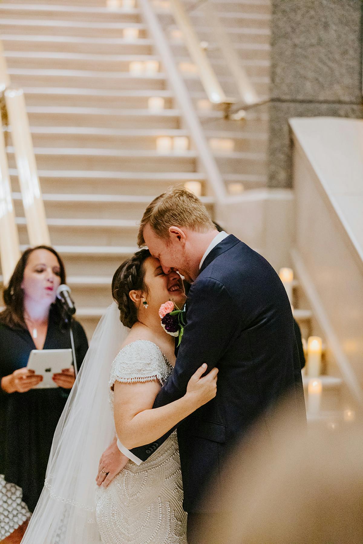 a man and a woman standing in front of a building