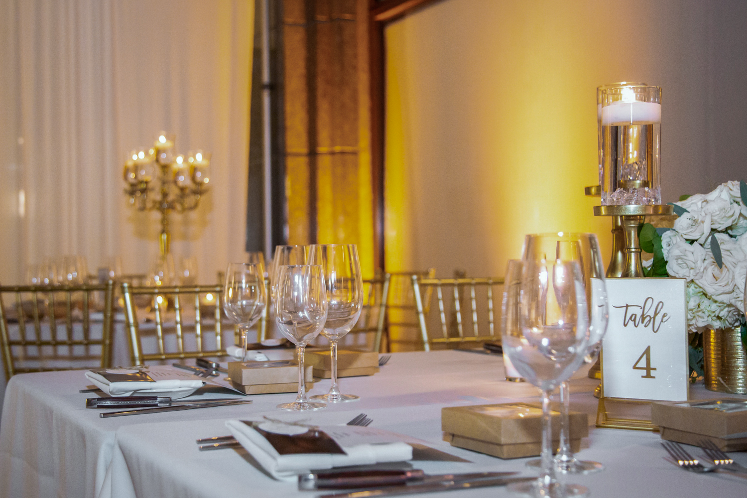 a group of people sitting at a table with wine glasses