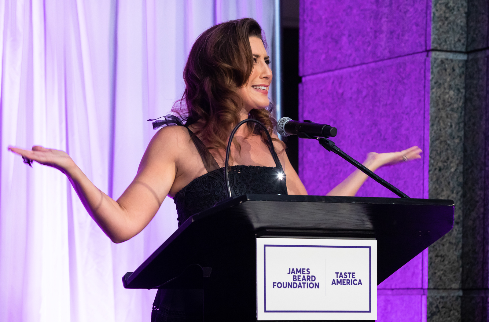 a woman standing in front of a building