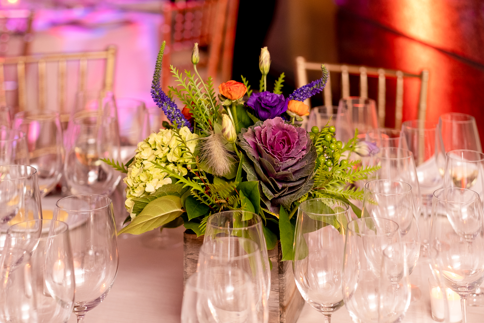a group of people sitting at a table with wine glasses