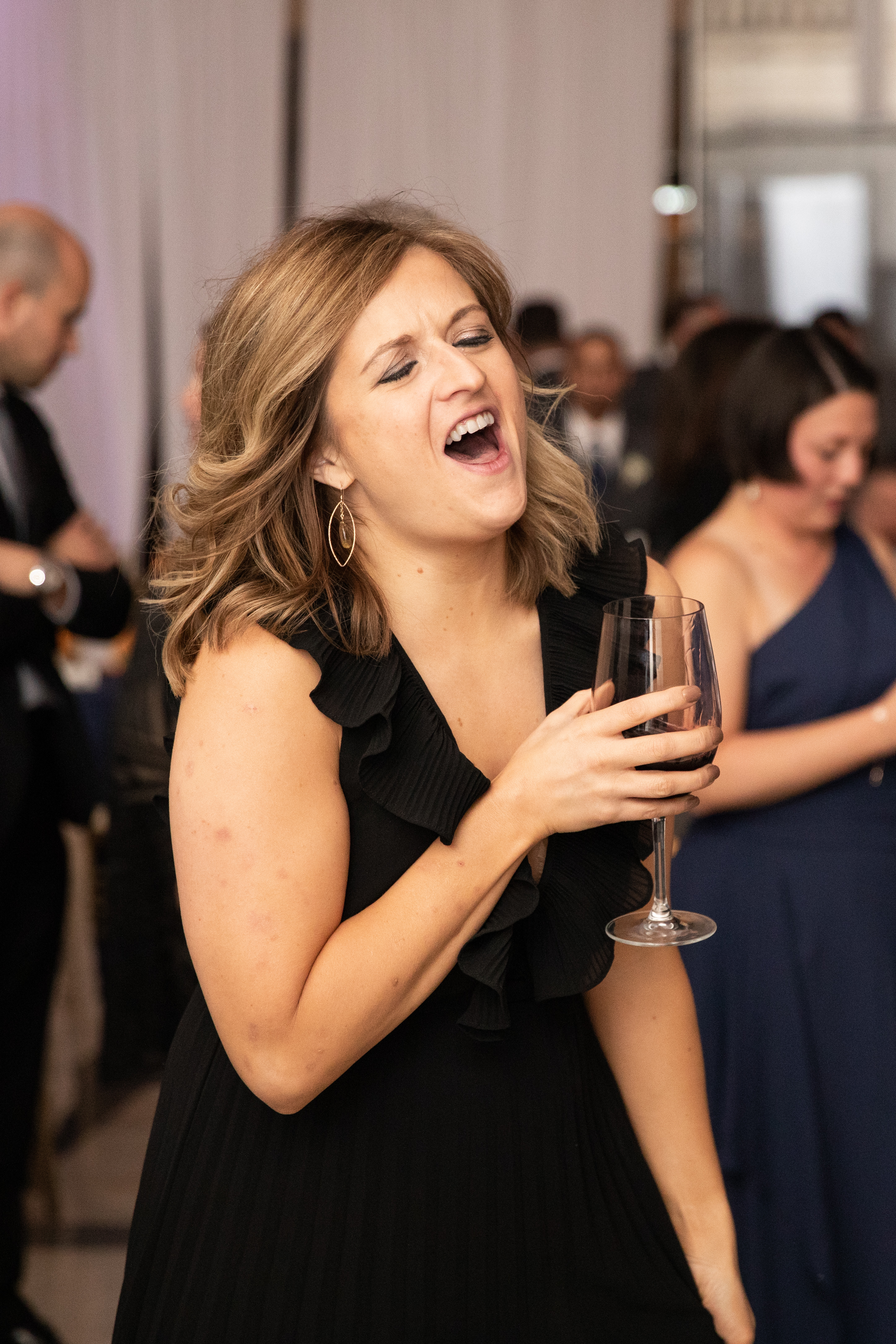 a woman holding a wine glass