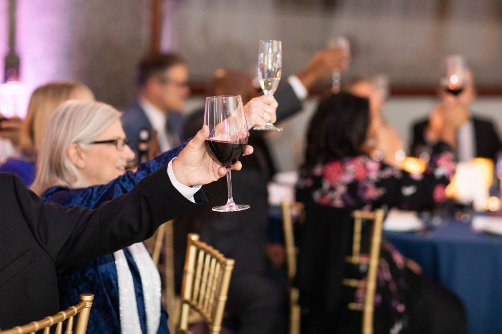a person holding a glass of wine