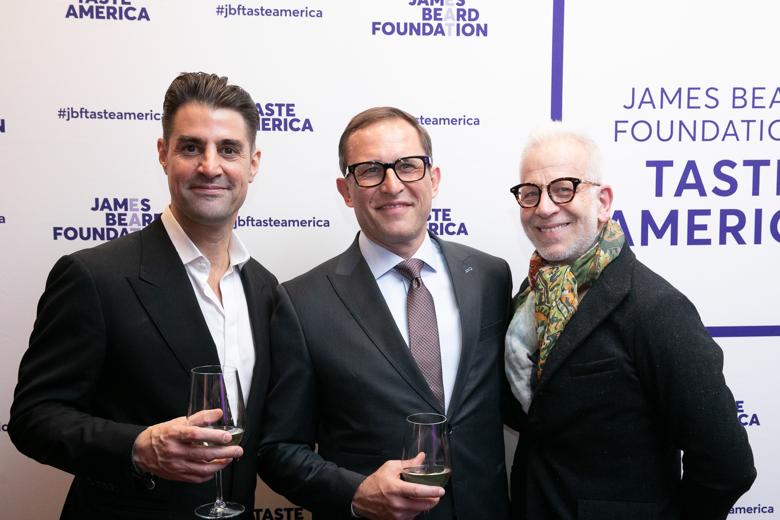 Kevin Boehm holding a sign posing for the camera