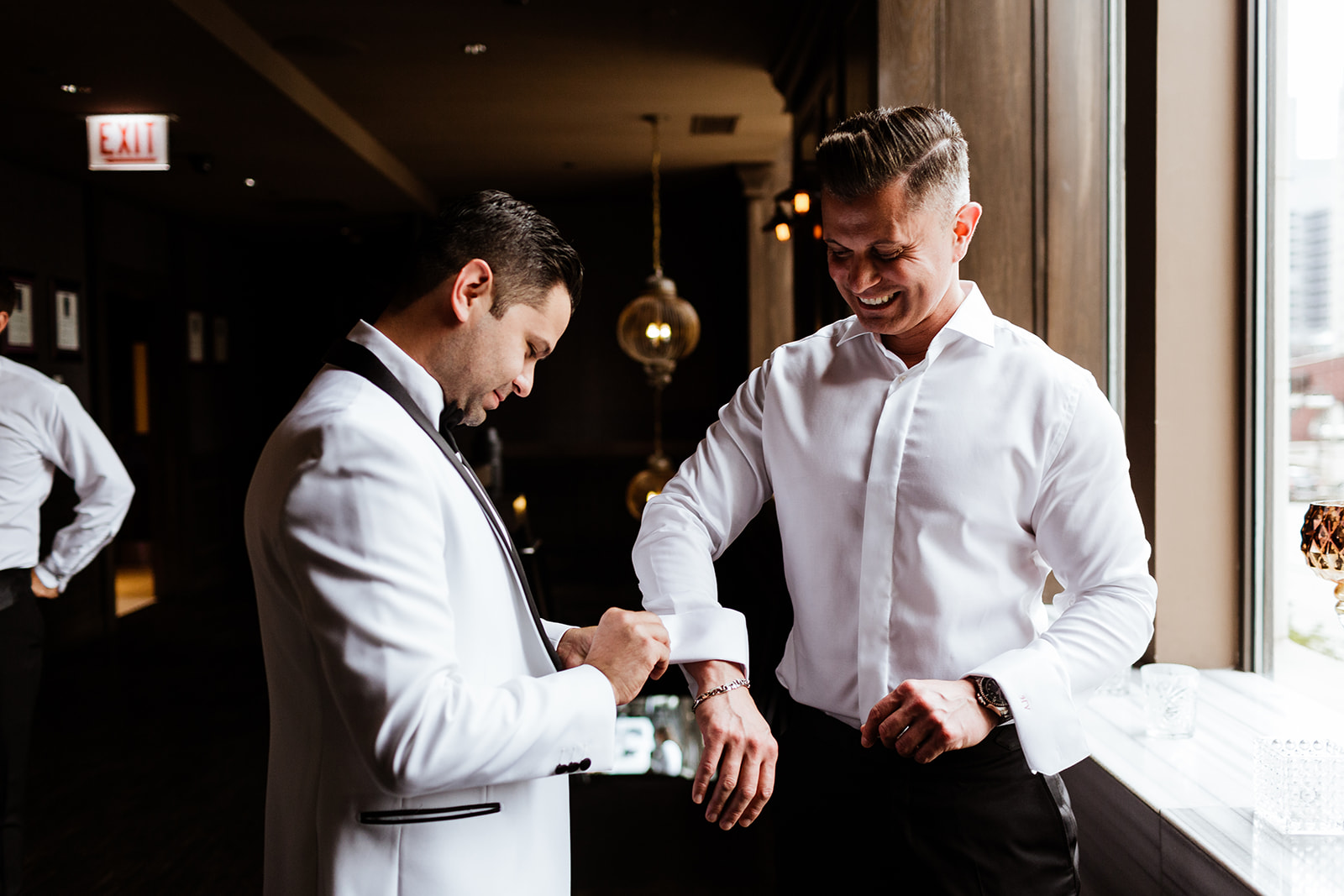a man cutting a cake