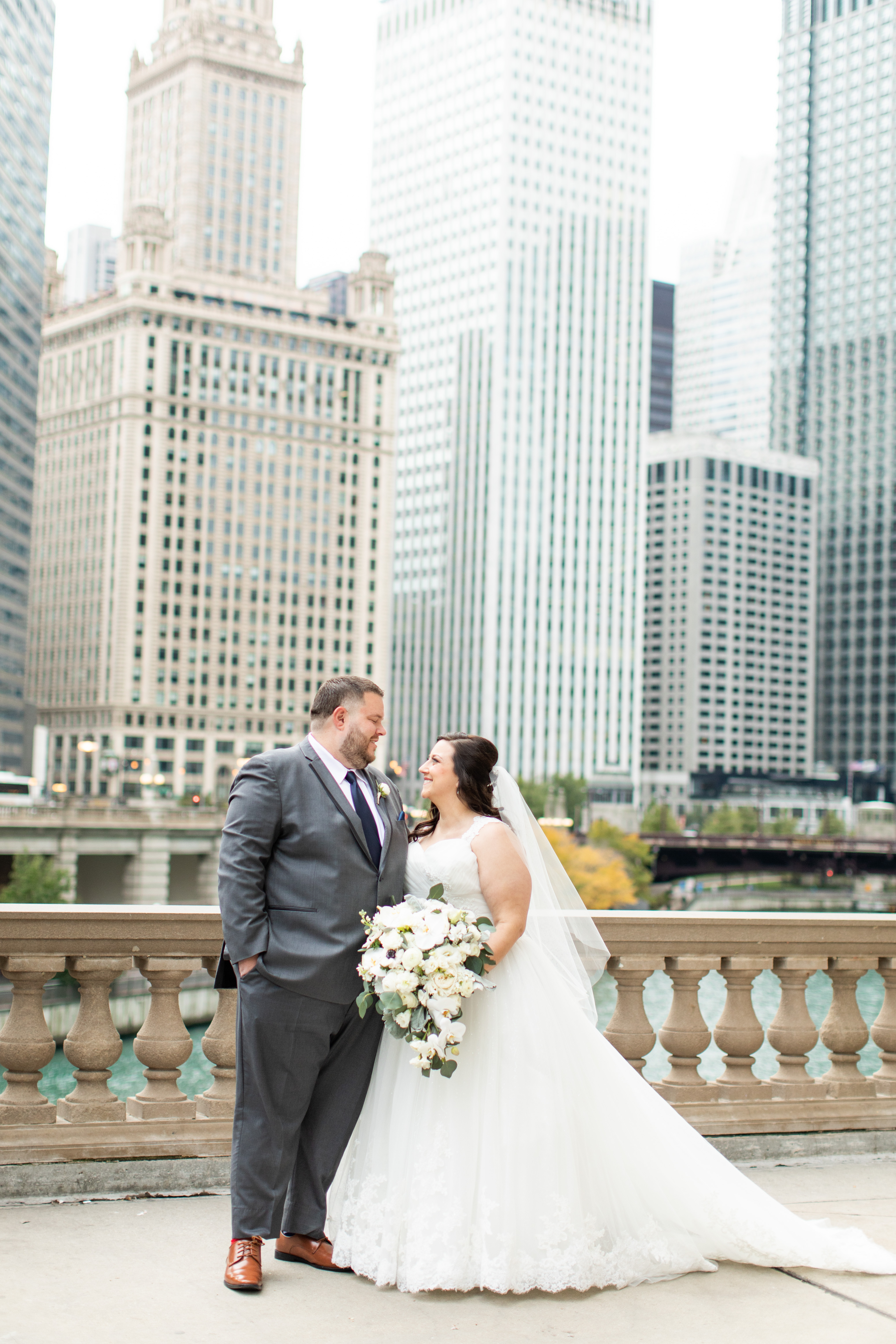 a man and a woman standing in front of a building