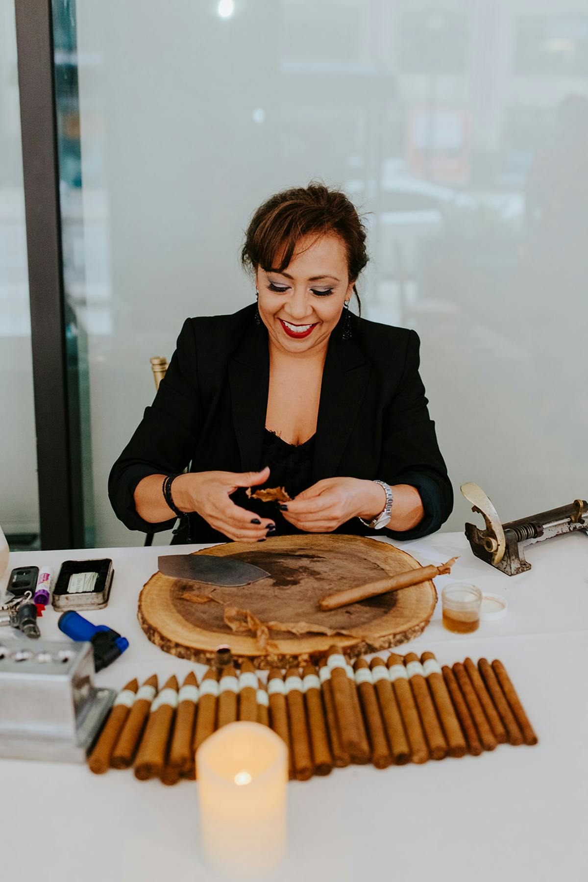 a person sitting at a table with a cake