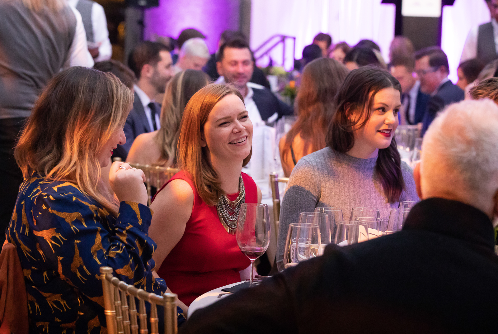 a group of people sitting in front of a crowd