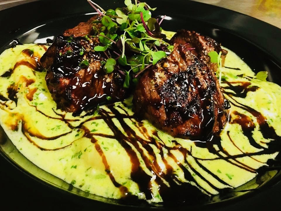 a plate of food with sauce and sauce