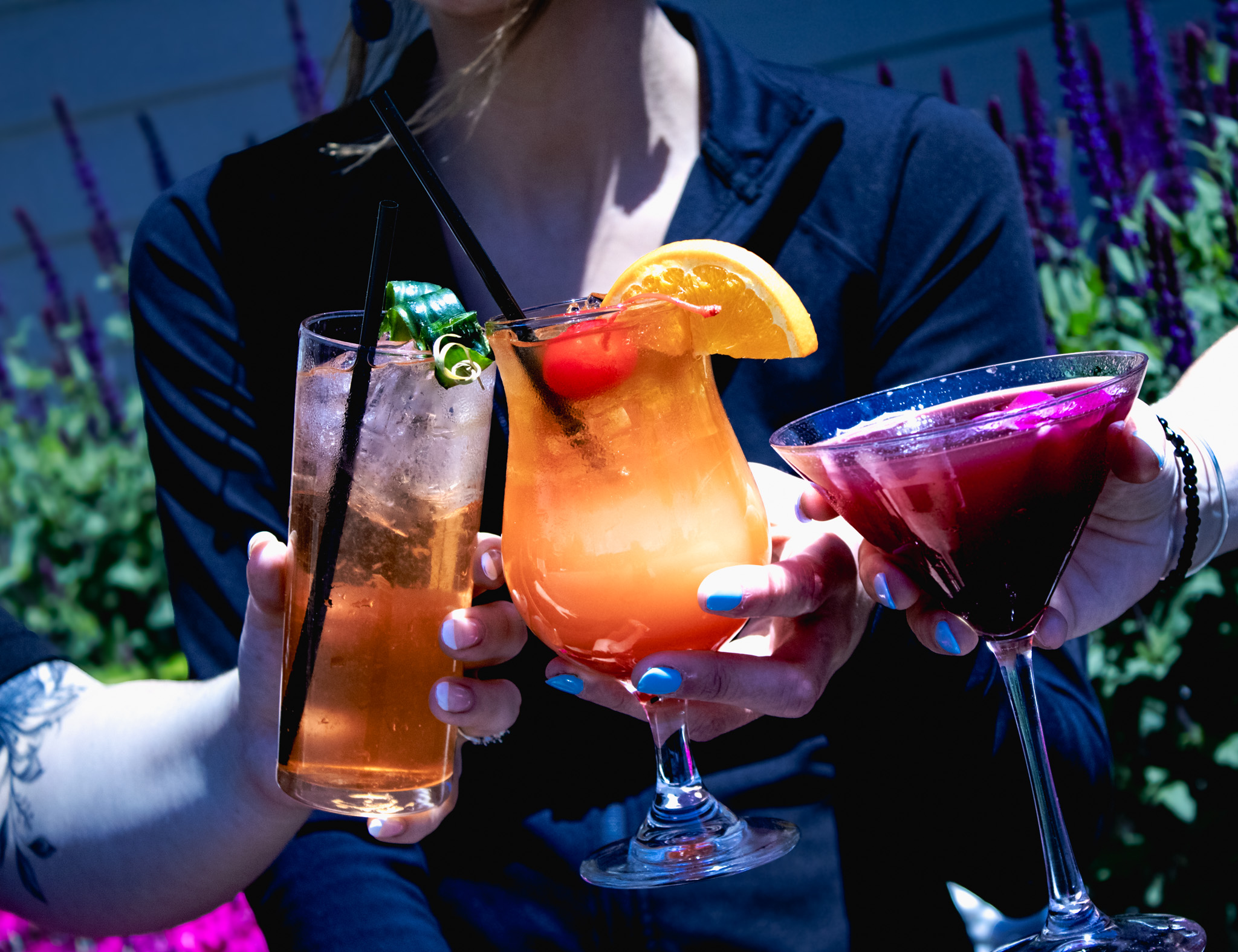 a group of people holding drinks