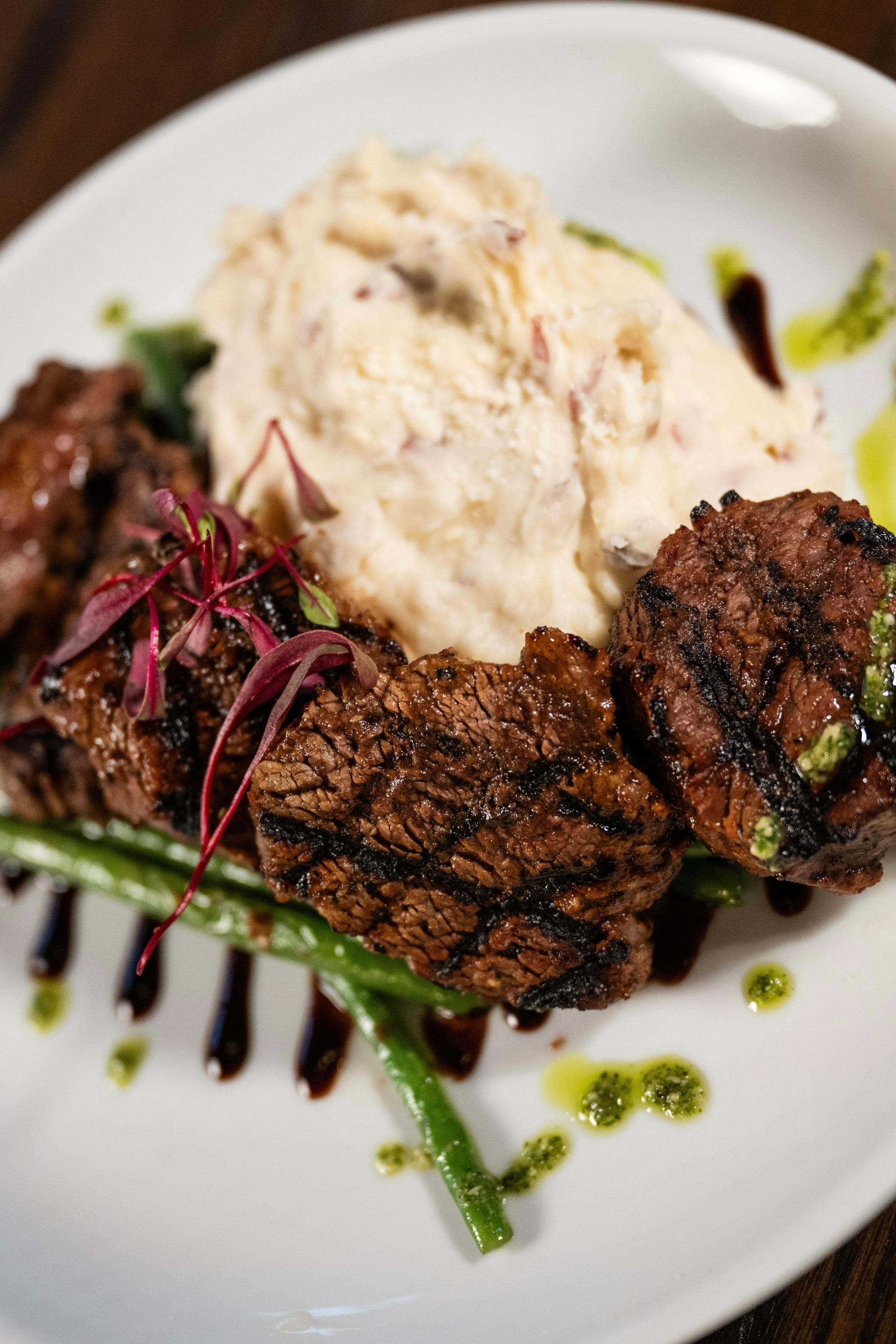 a plate of food with mashed potatoes and meat