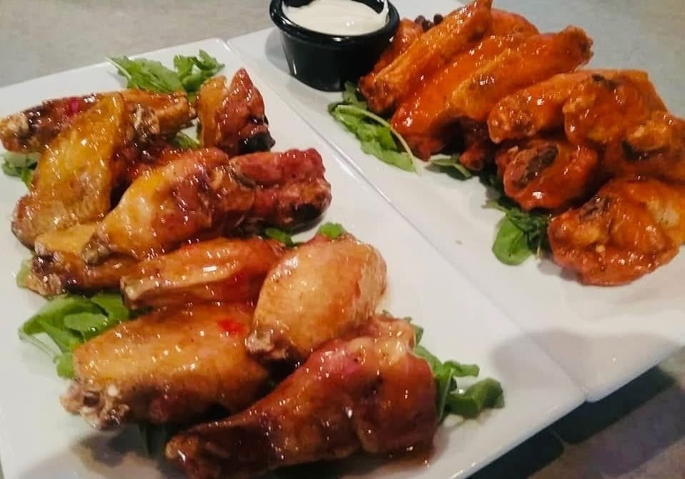 a plate of chicken wings