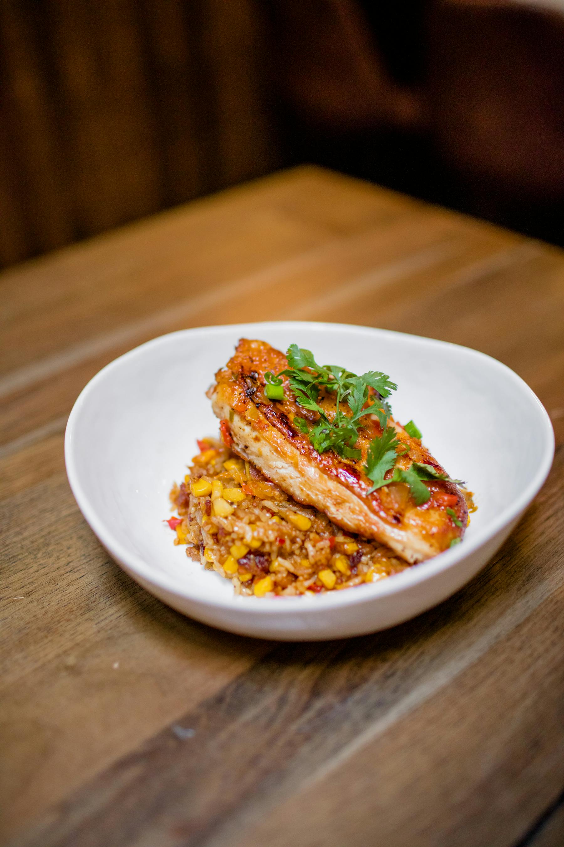 a plate of food sitting on top of a wooden table