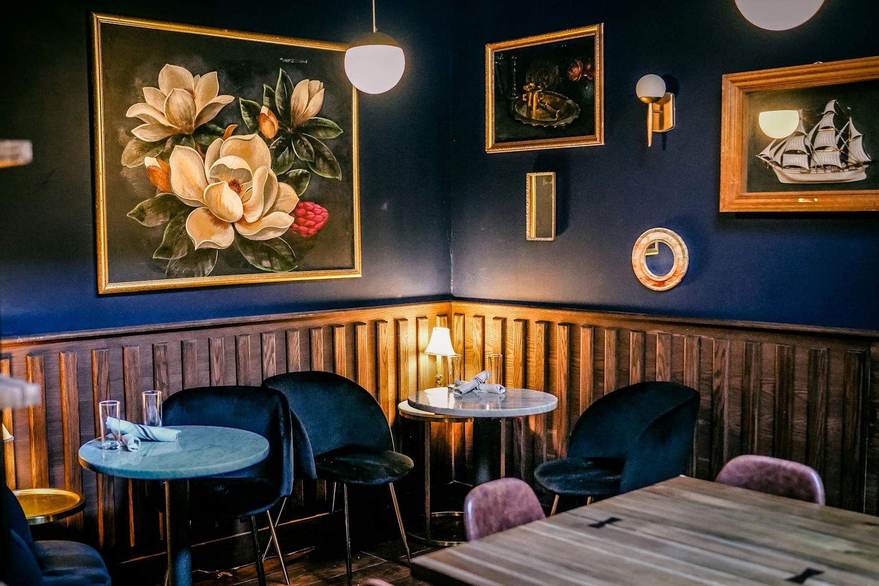 a bedroom with a bed and a chair in a room