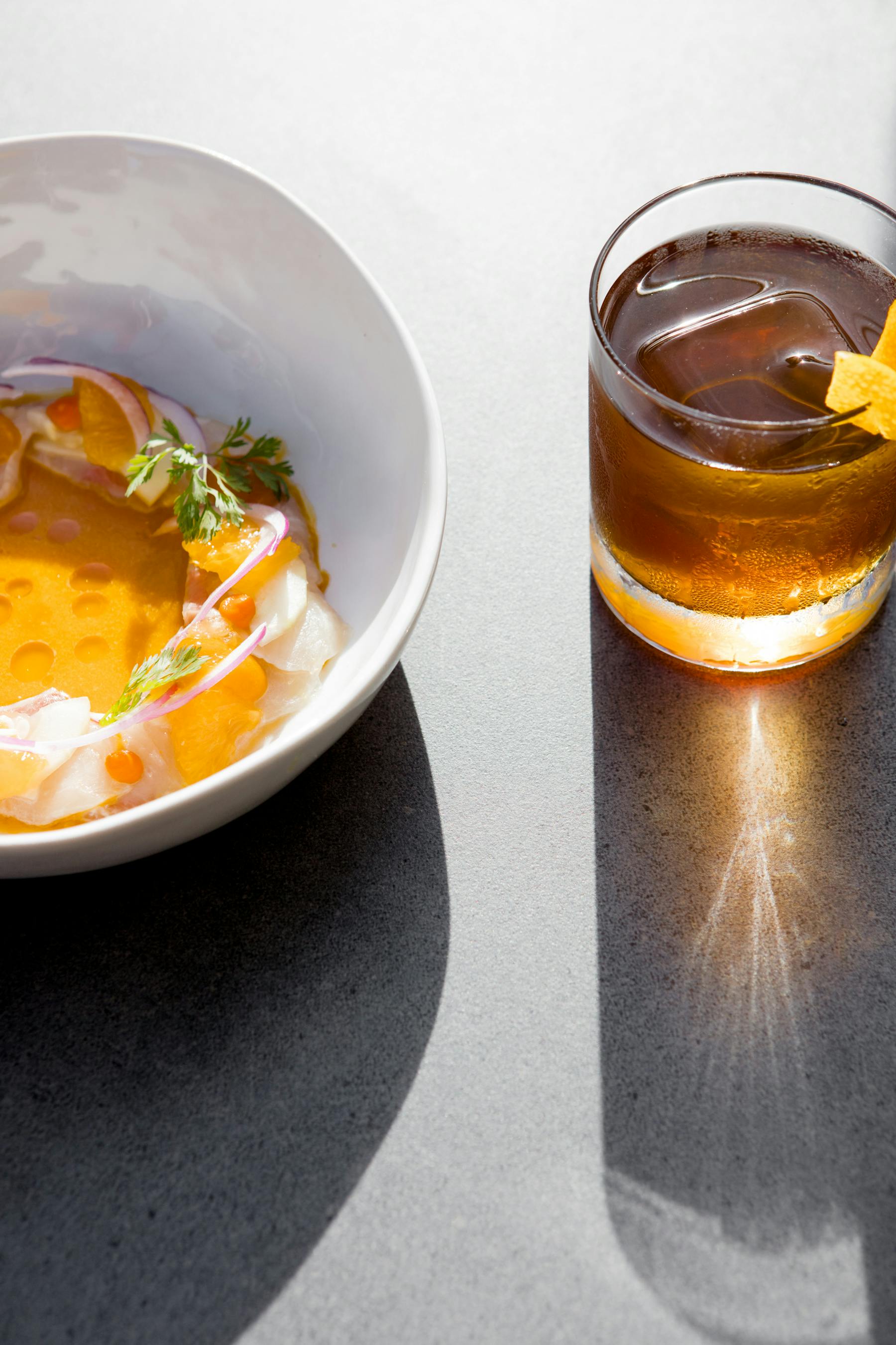 a cup of coffee and a glass of orange juice