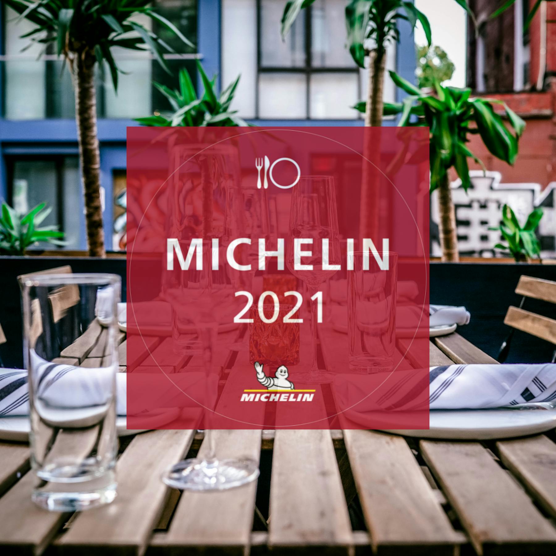 a table that has a sign on the side of a building