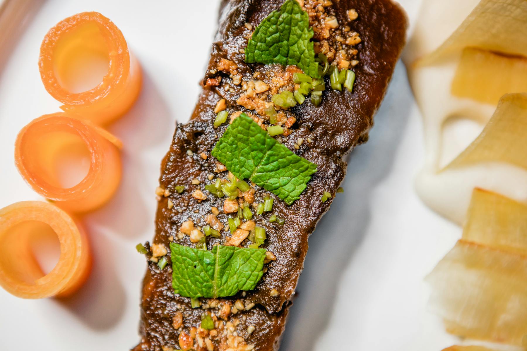 a plate of food with a slice of orange