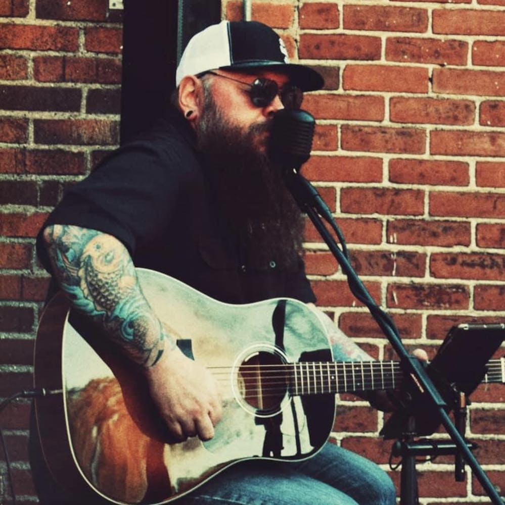 a man holding a guitar