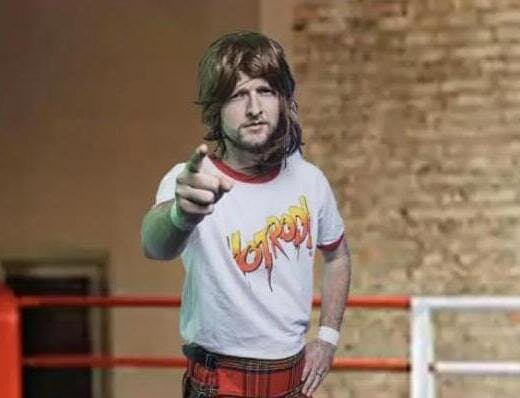 a person in a wig pointing
