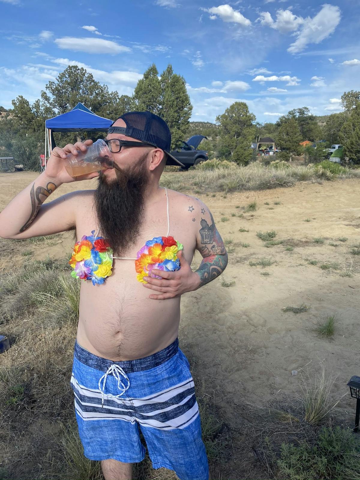 a man drinking from a river