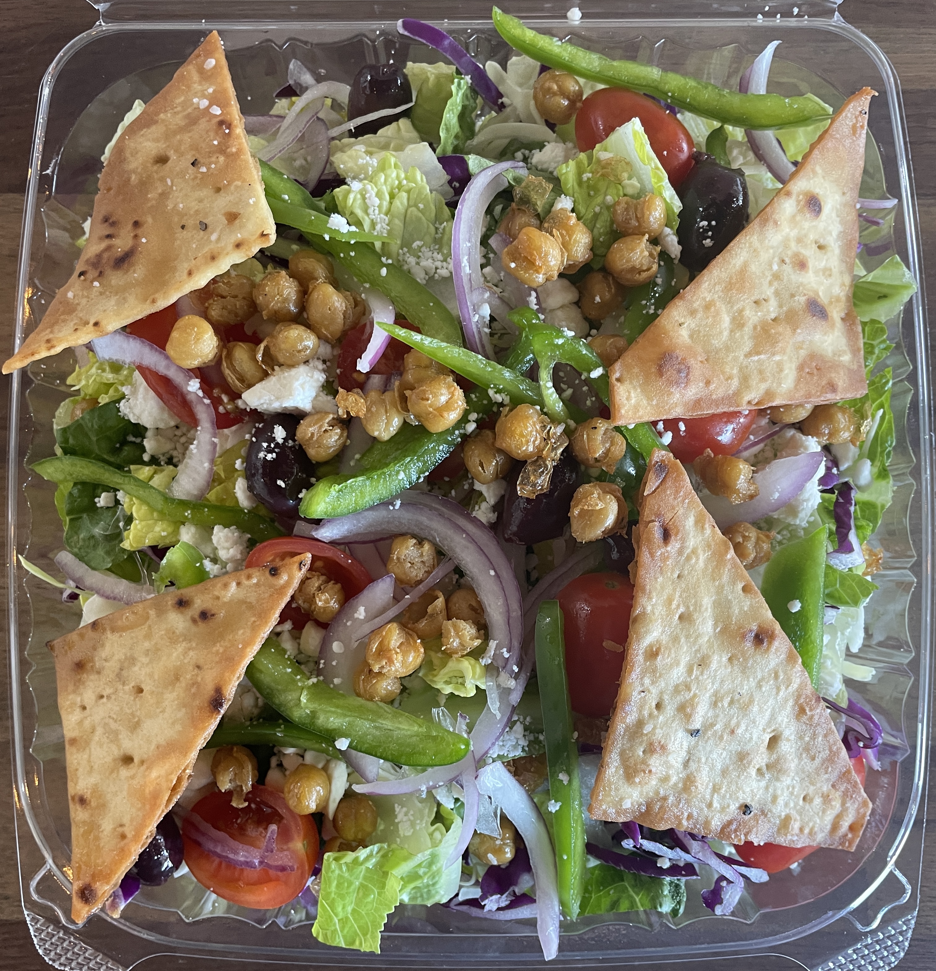 a close up of a plate of food with a sandwich and a salad