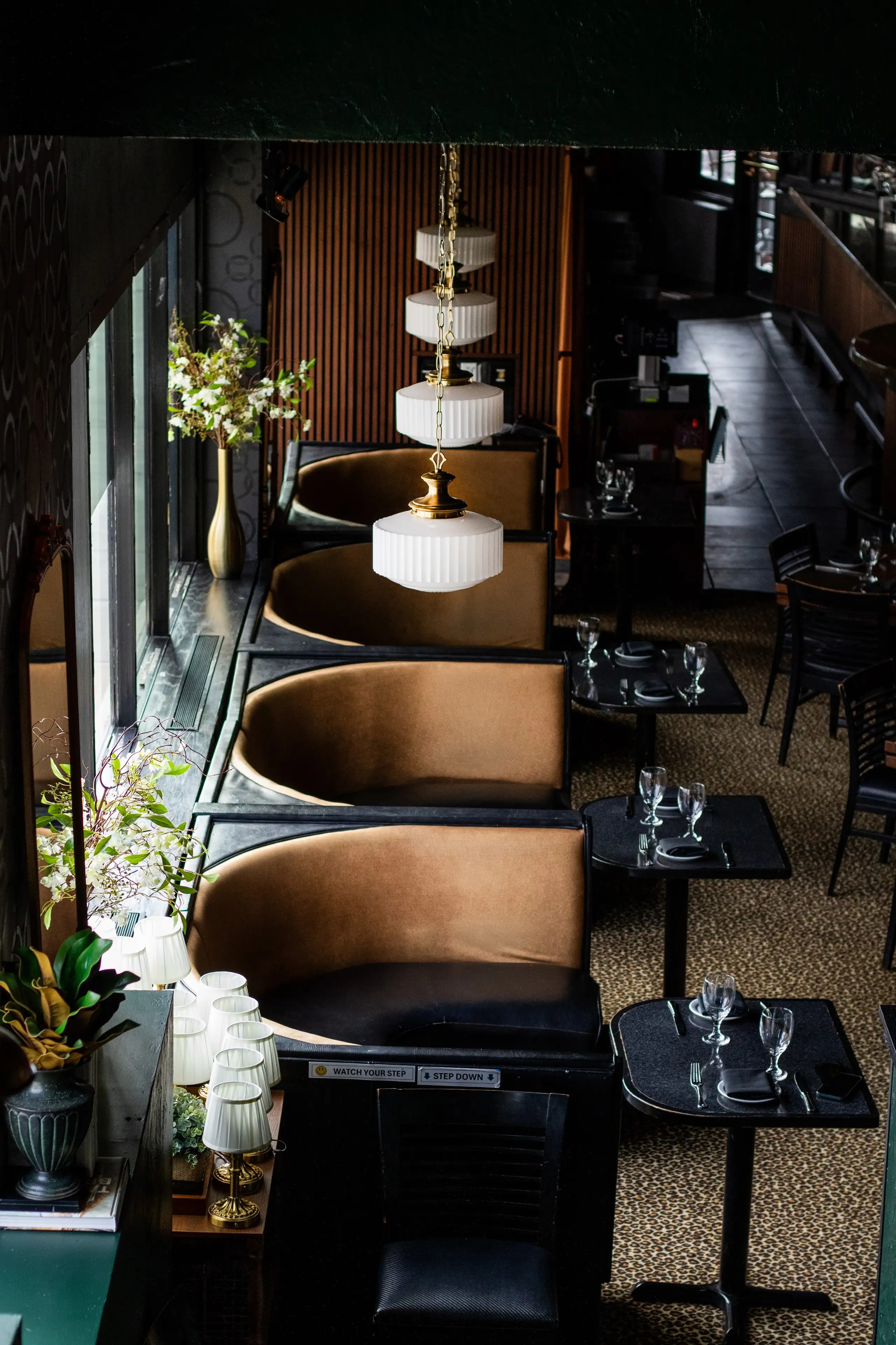 a chandelier from a ceiling in a restaurant