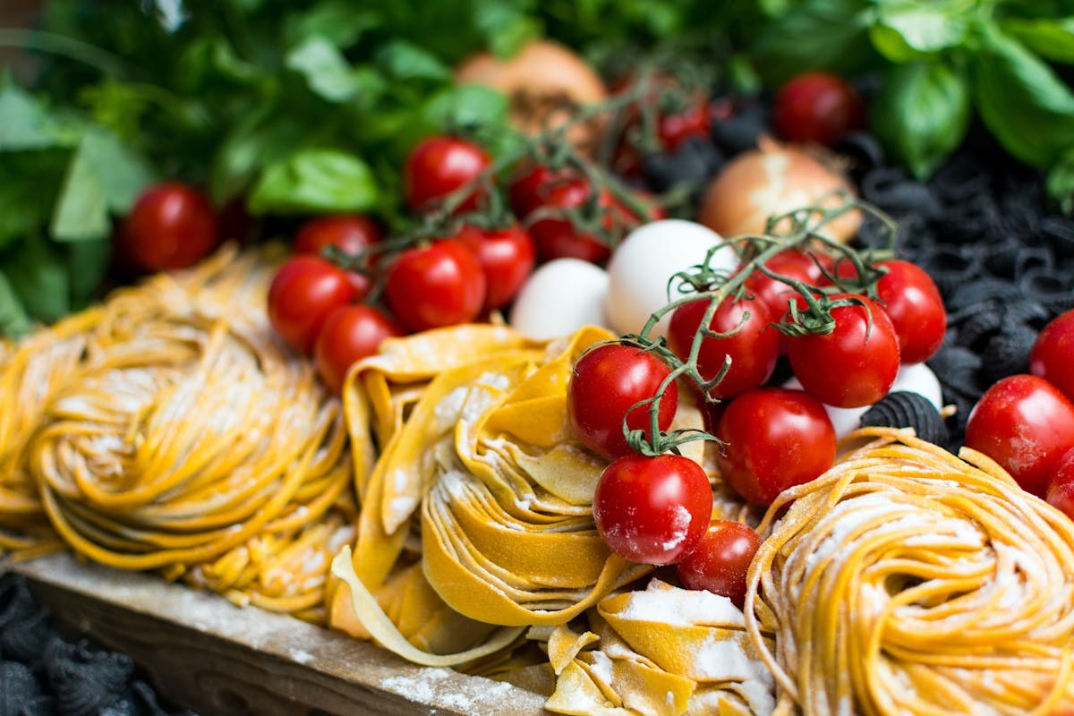 a plate is filled with fresh fruit and vegetables