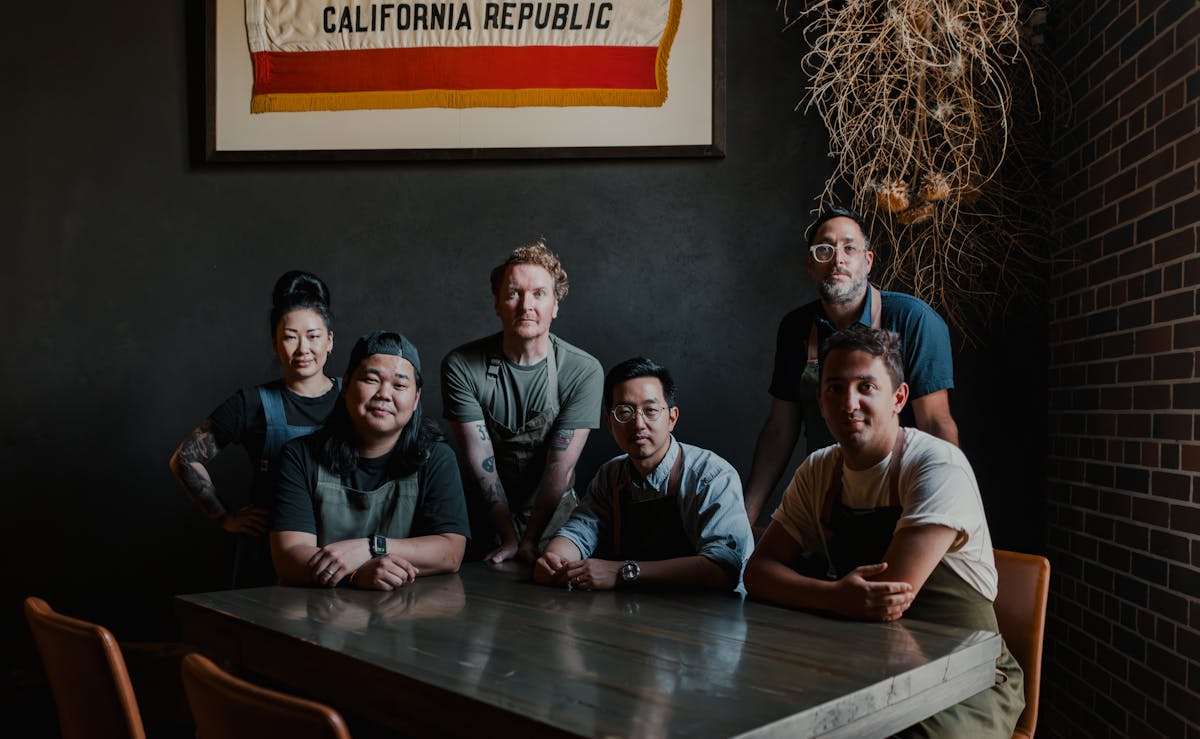 a group of chefs at a table