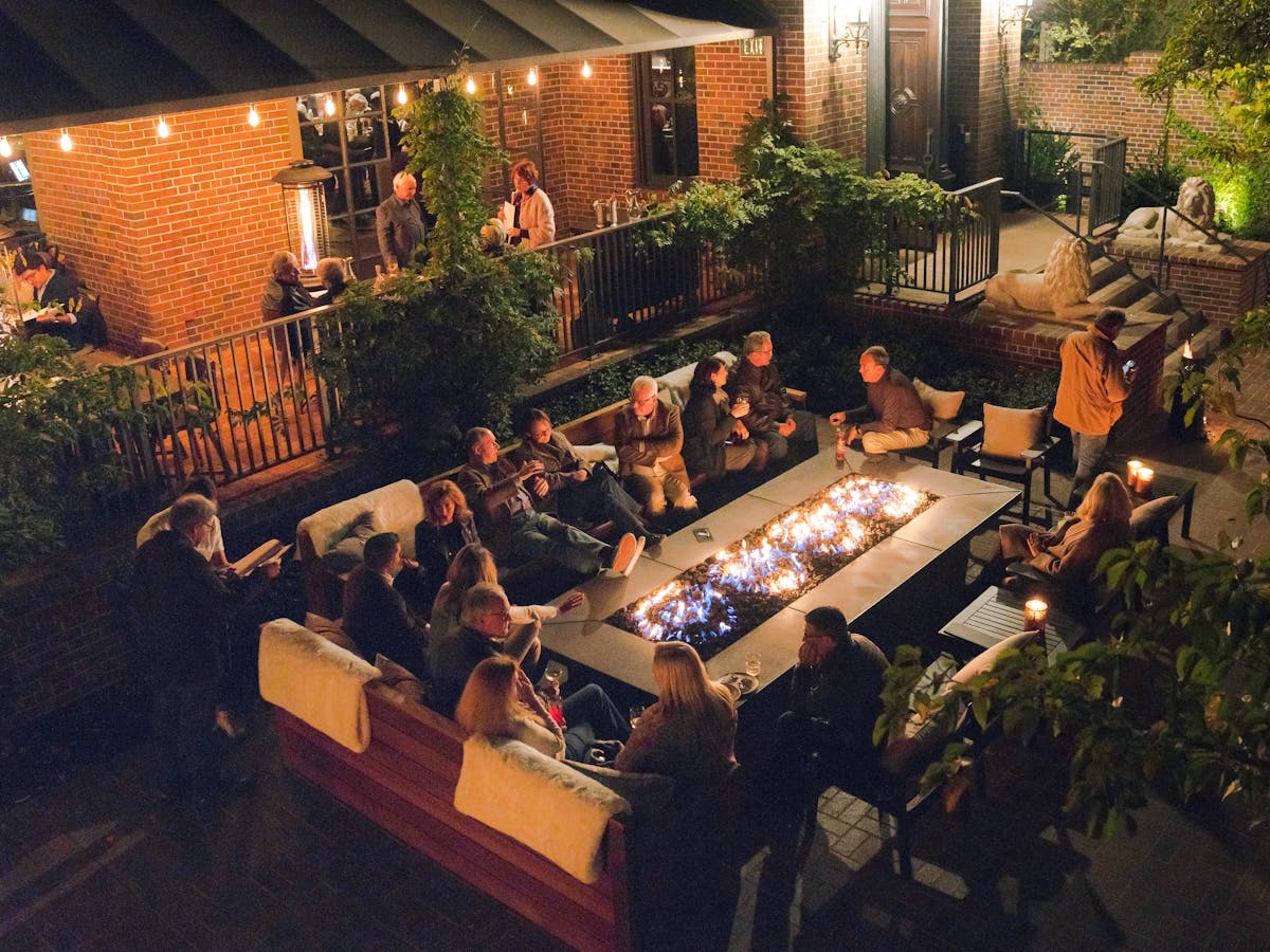 a group of people sitting around a living room