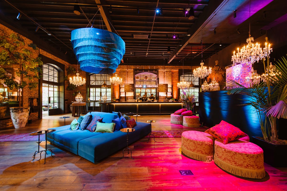 the charter oak dining room with lounge chairs and colorful lighting